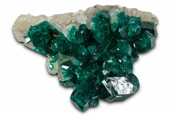 A cluster of vibrant, emerald-green dioptase crystals perched on quartz from the Congo. 